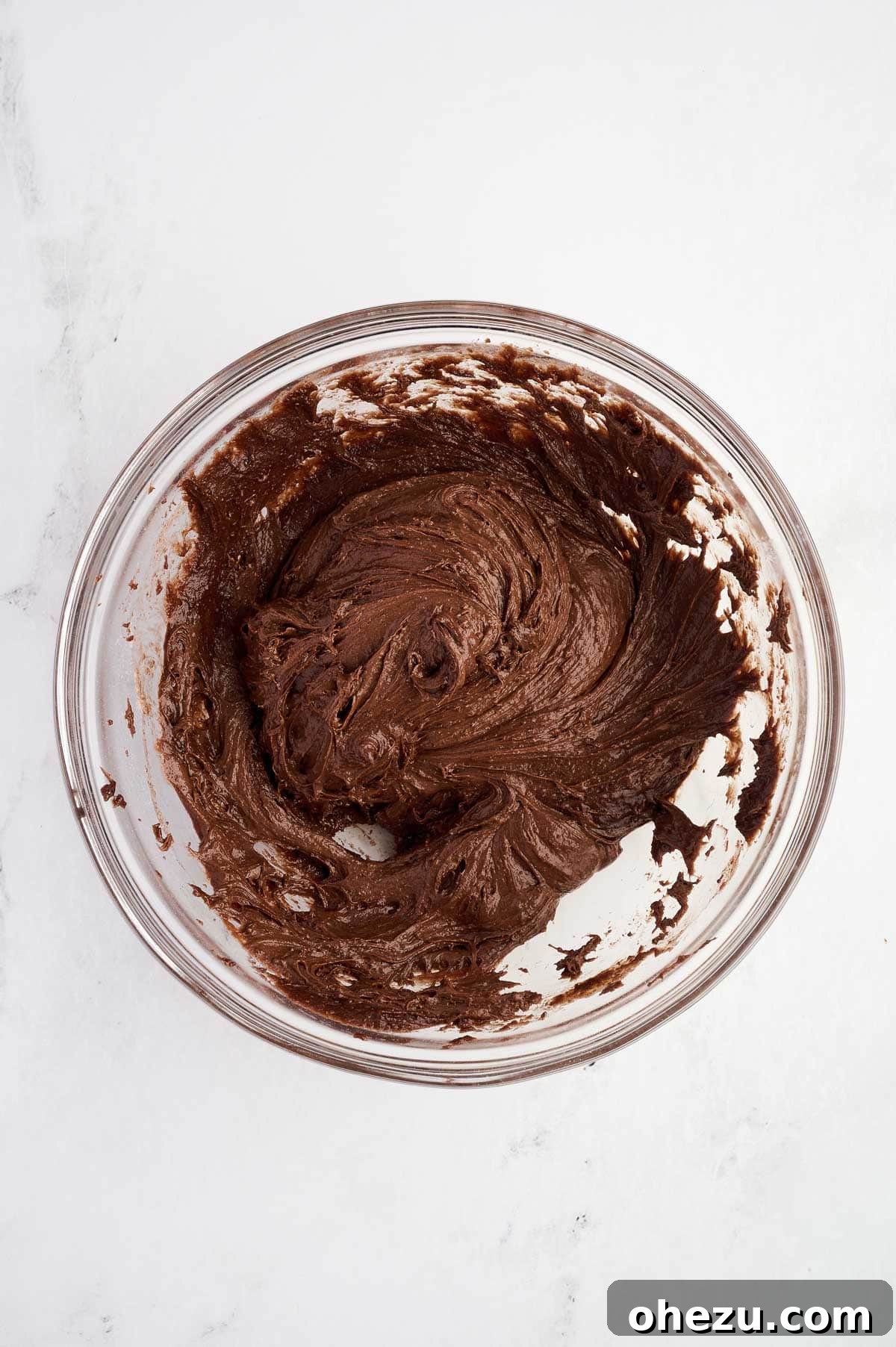 thick chocolate cookie batter mixed together in a bowl