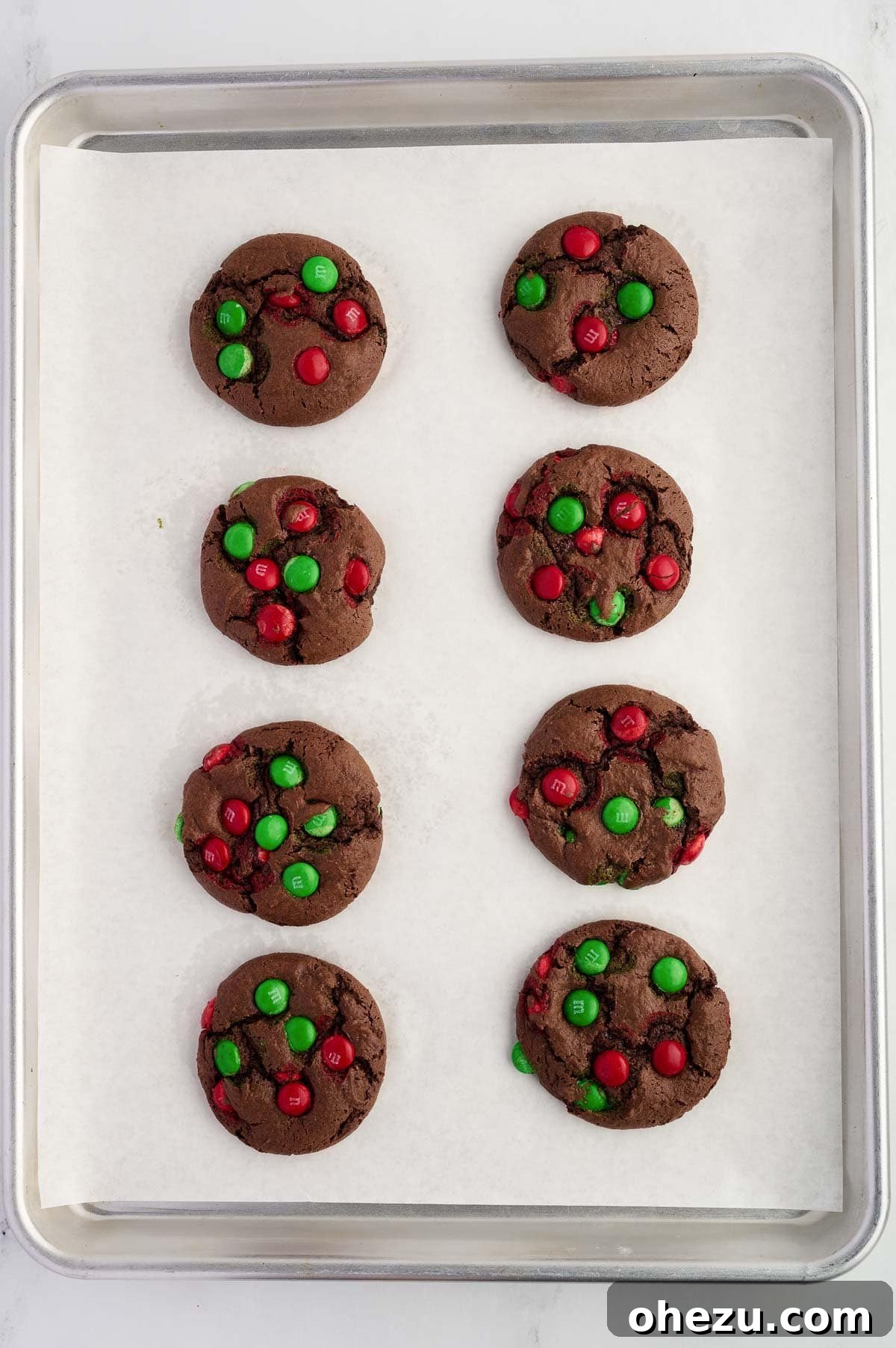 unbaked chocolate Christmas cookies on a baking sheet ready for the oven