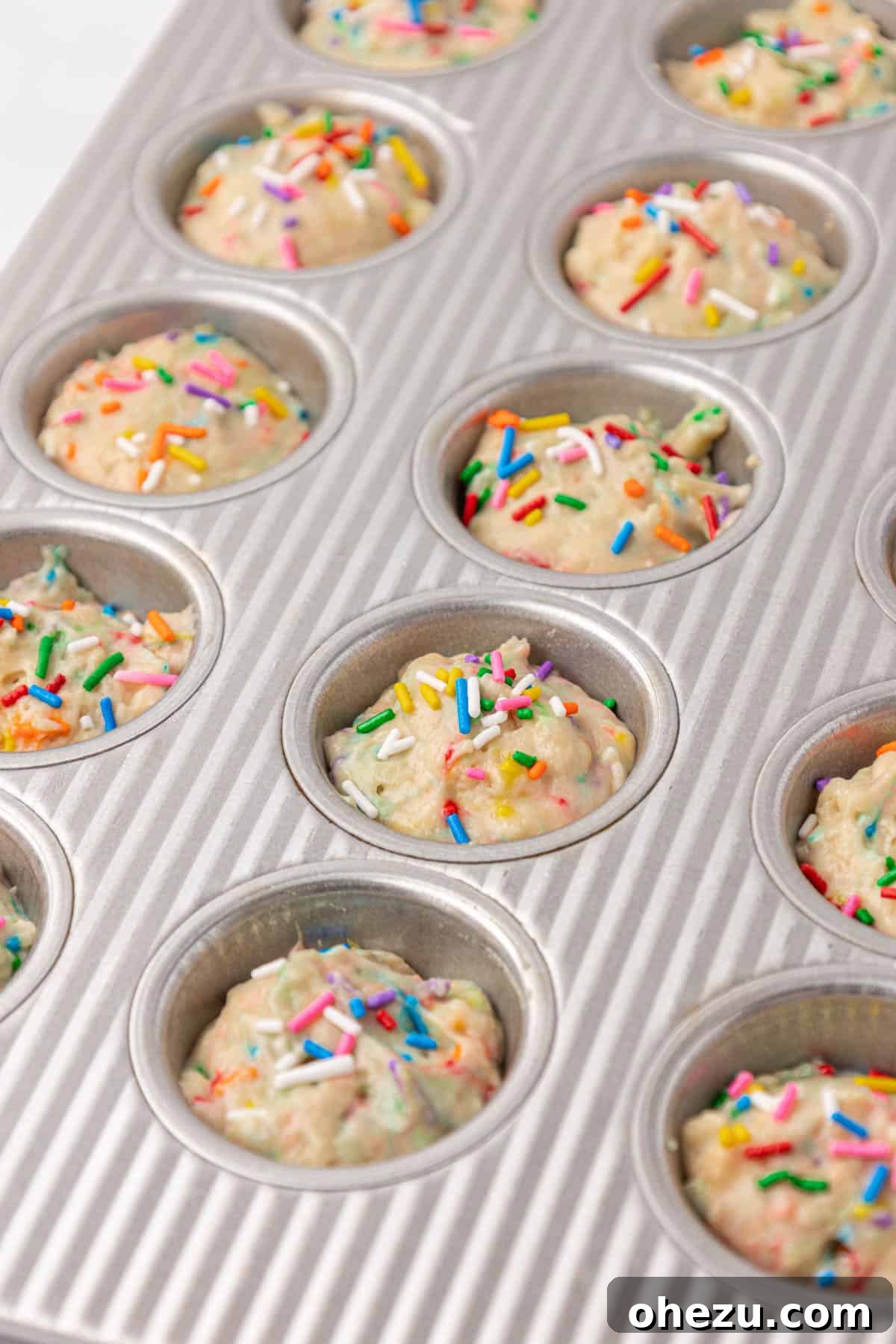 Mini muffin tin filled with batter, ready for the oven