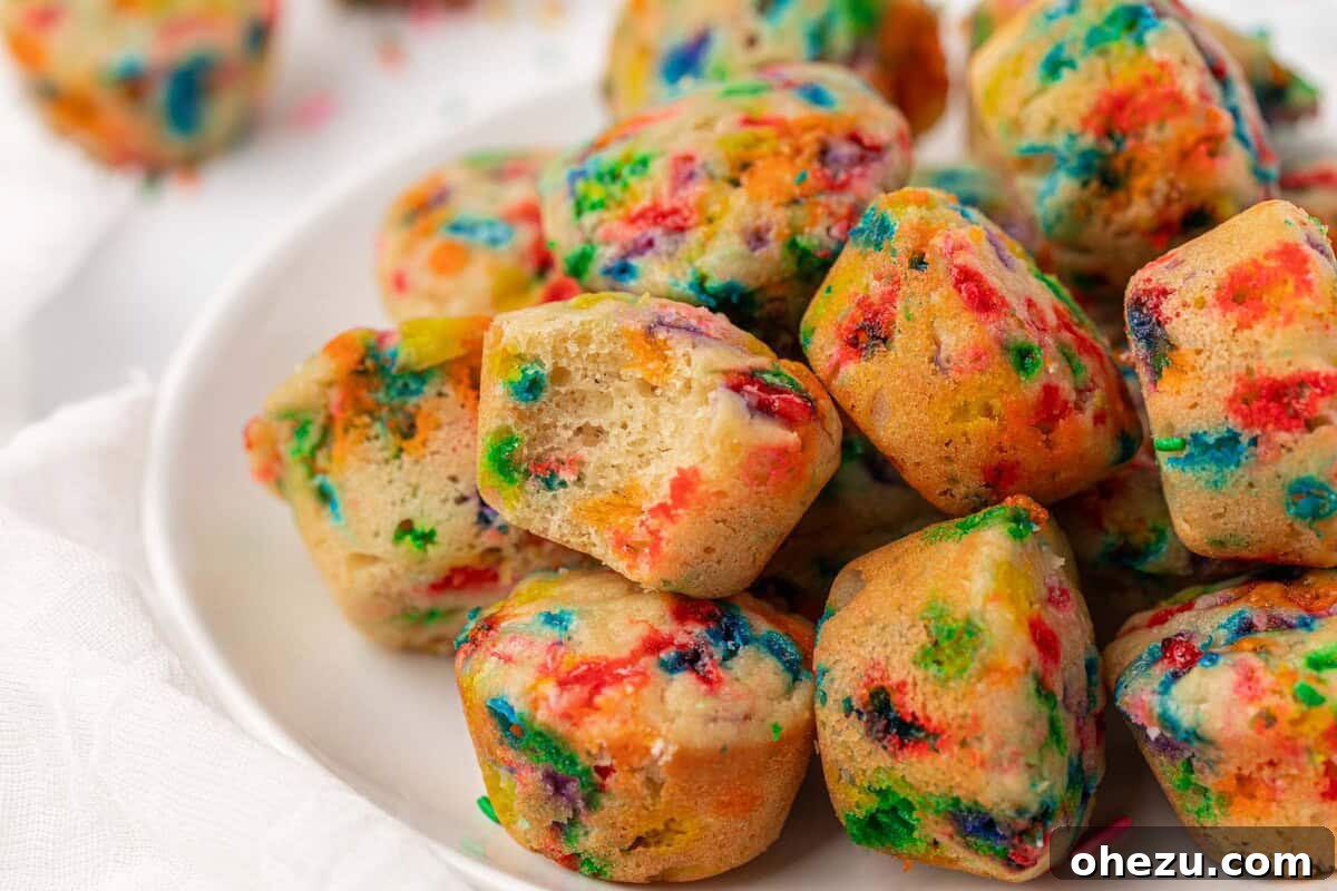 Close-up of birthday cake mini muffins on a cooling rack, ready to be packaged or served