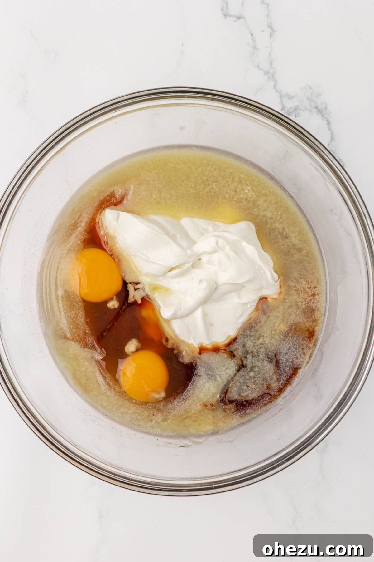 Wet ingredients for muffins in a separate mixing bowl