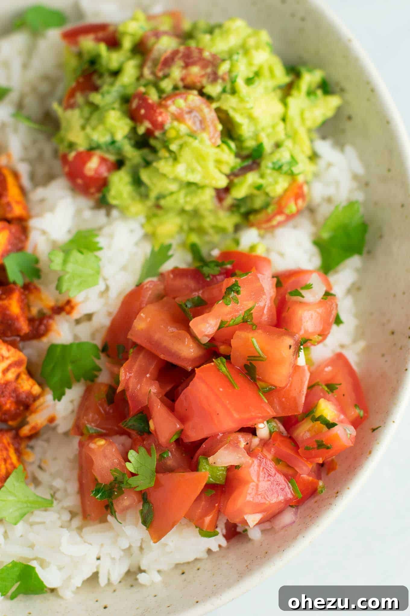 Quick Fiesta Tofu Burrito Bowls 6 A beautifully presented bowl of fresh, vibrant homemade guacamole.