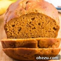 pumpkin bread being cut into slices