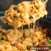 This Slow Cooker Vegetarian Chili Mac Recipe is made all in the crockpot (even the noodles!). A super easy vegetarian crockpot recipe to feed a crowd. #vegetarian #slowcooker #crockpot #chilimac
