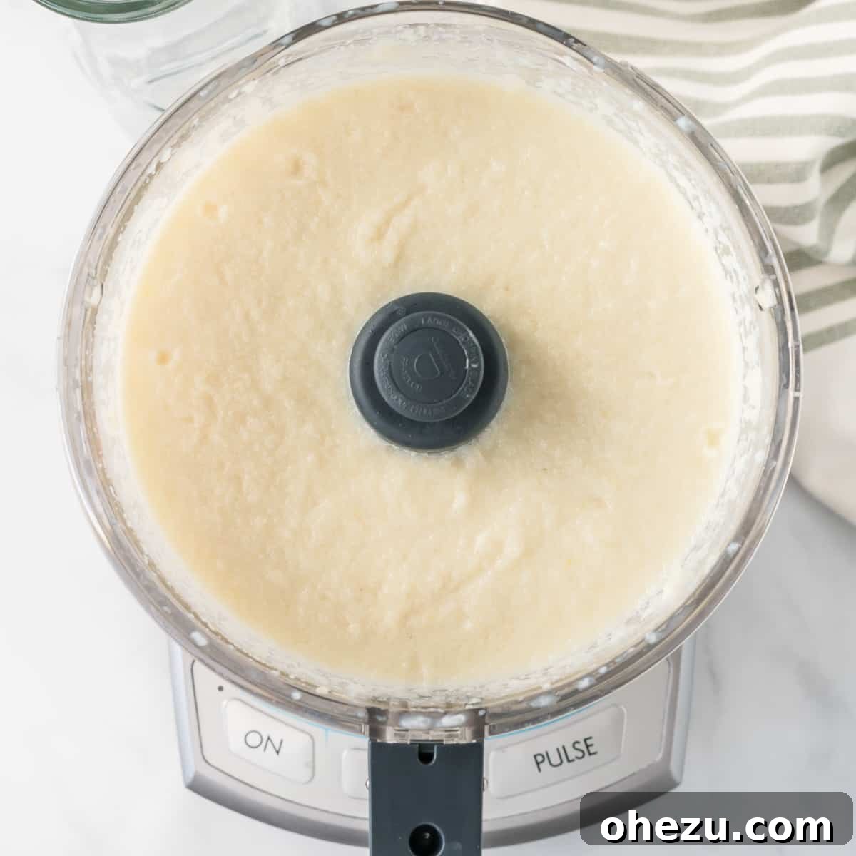 cauliflower mixed together with milk in a food processor