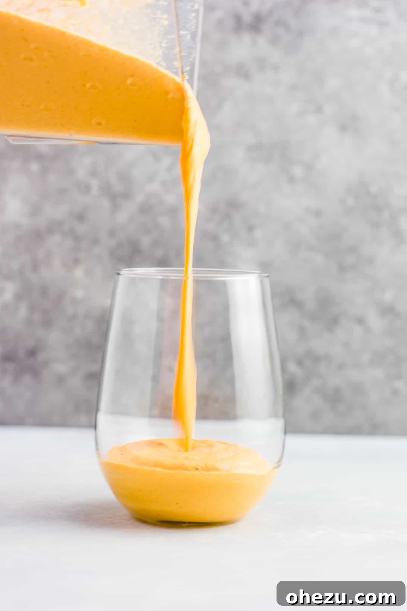 Frozen pumpkin puree cubes in an ice cube tray, ready to be used for the smoothie.