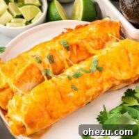 Two sweet potato black bean enchiladas on a plate