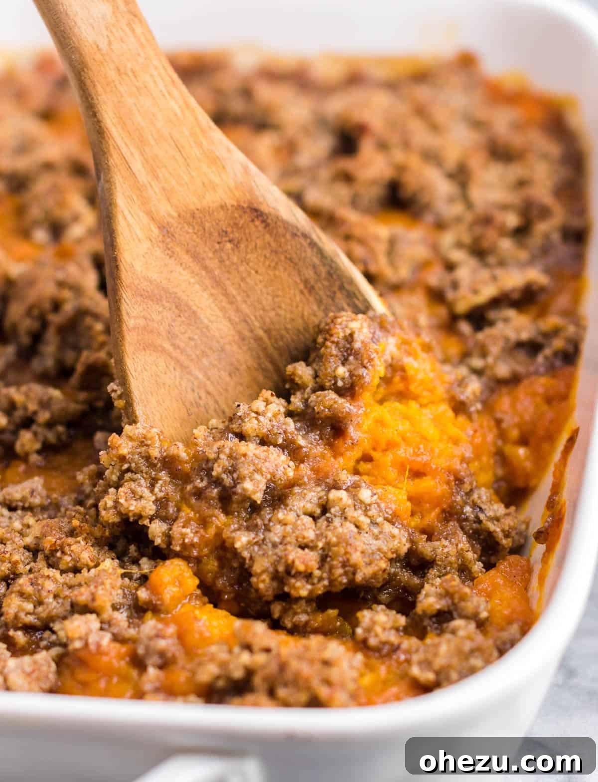 Golden Gluten-Free Sweet Potato Bake 2 Gluten-free sweet potato casserole with a golden brown pecan topping, ready to be served