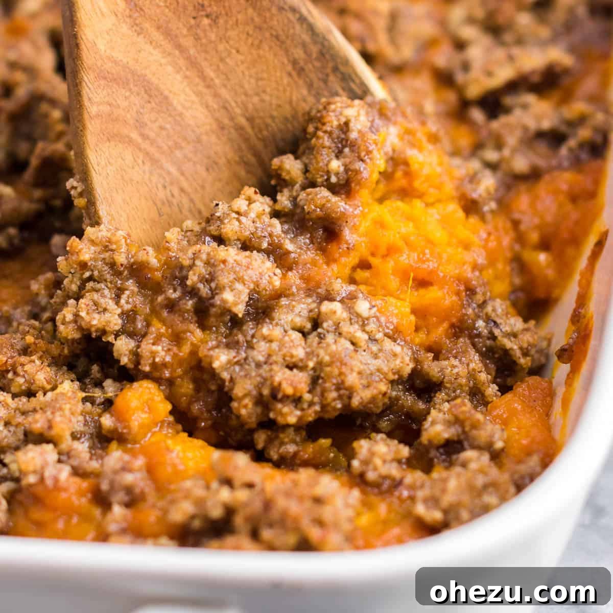 Golden Gluten-Free Sweet Potato Bake 14 A vibrant, close-up shot of the gluten-free sweet potato casserole with its inviting pecan topping