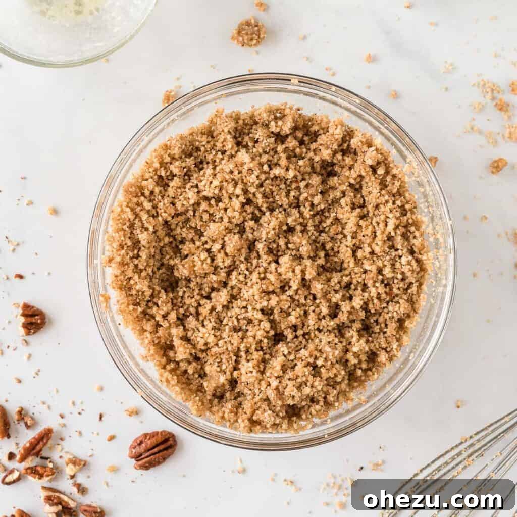 Golden Gluten-Free Sweet Potato Bake 10 The pecan topping ingredients mixed together, showing a crumbly, wet sand-like texture