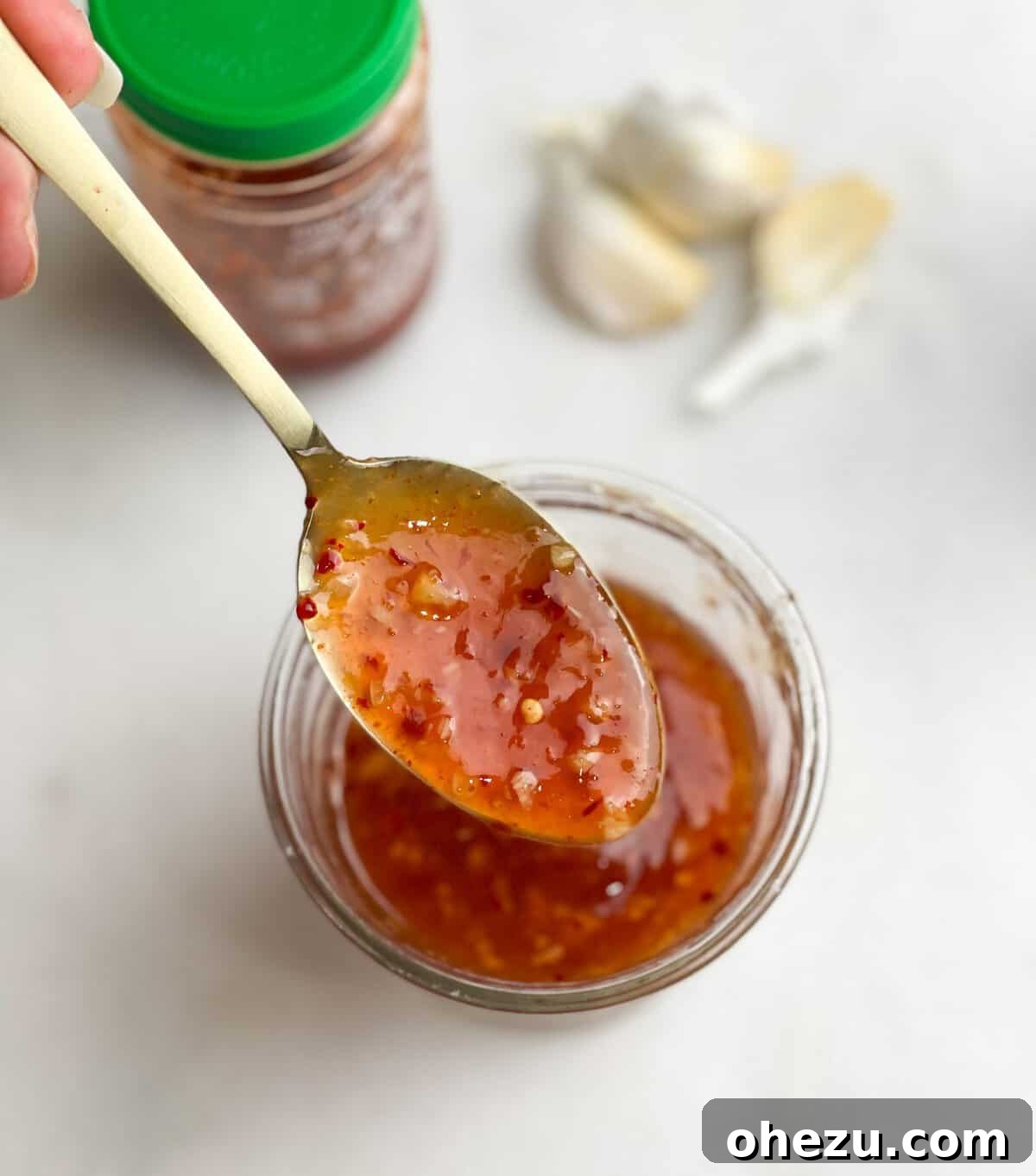 Multiple mason jars filled with homemade sweet chili sauce, ready for refrigeration