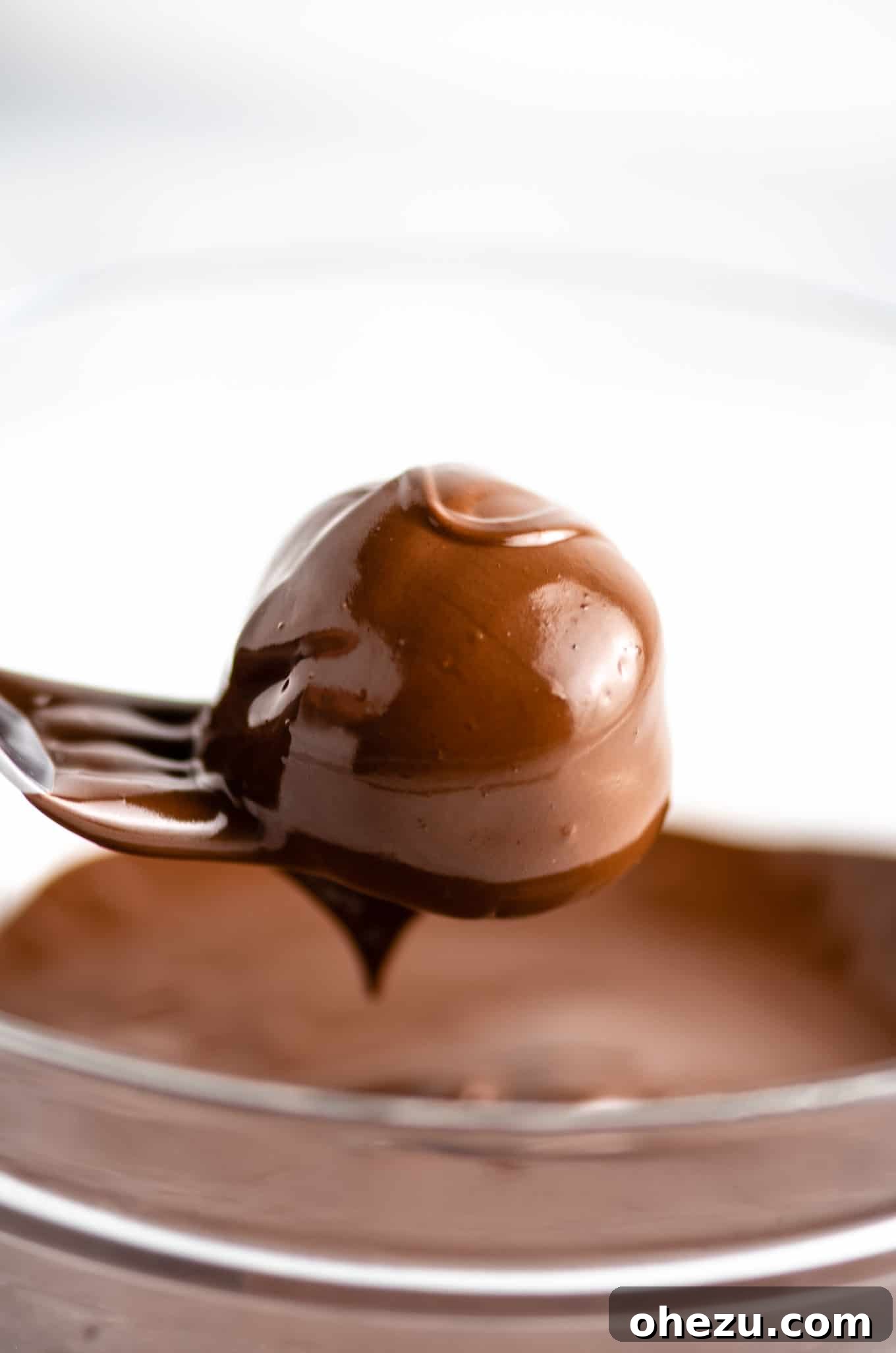 Guilt-Free No Bake Peanut Butter Bites 7 dipping truffles in chocolate