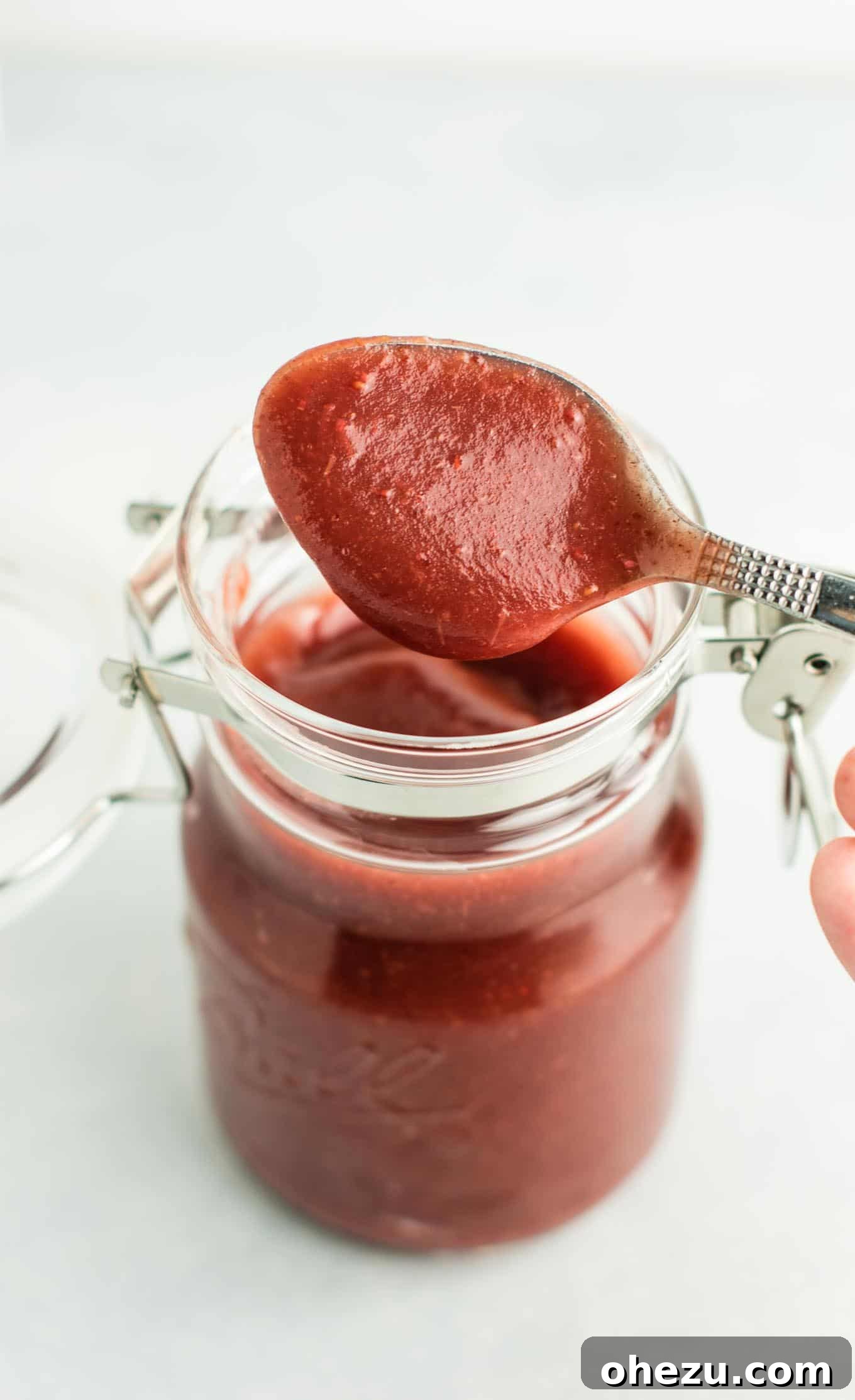 Sweet & Tangy Slow Cooker Cranberry Apple Butter 4 Cooking cranberry apple butter in a slow cooker, showing the fruit beginning to soften. (vegan, gluten free, naturally sweetened)