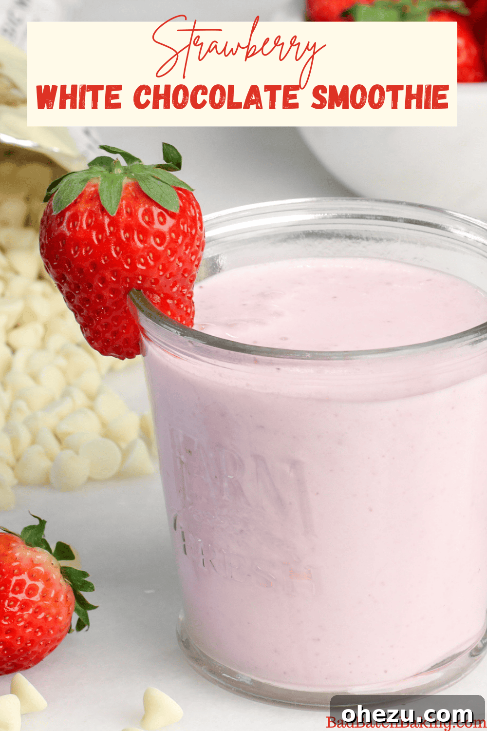 Two glasses of Strawberry White Chocolate Smoothie side-by-side, garnished with fresh strawberries.