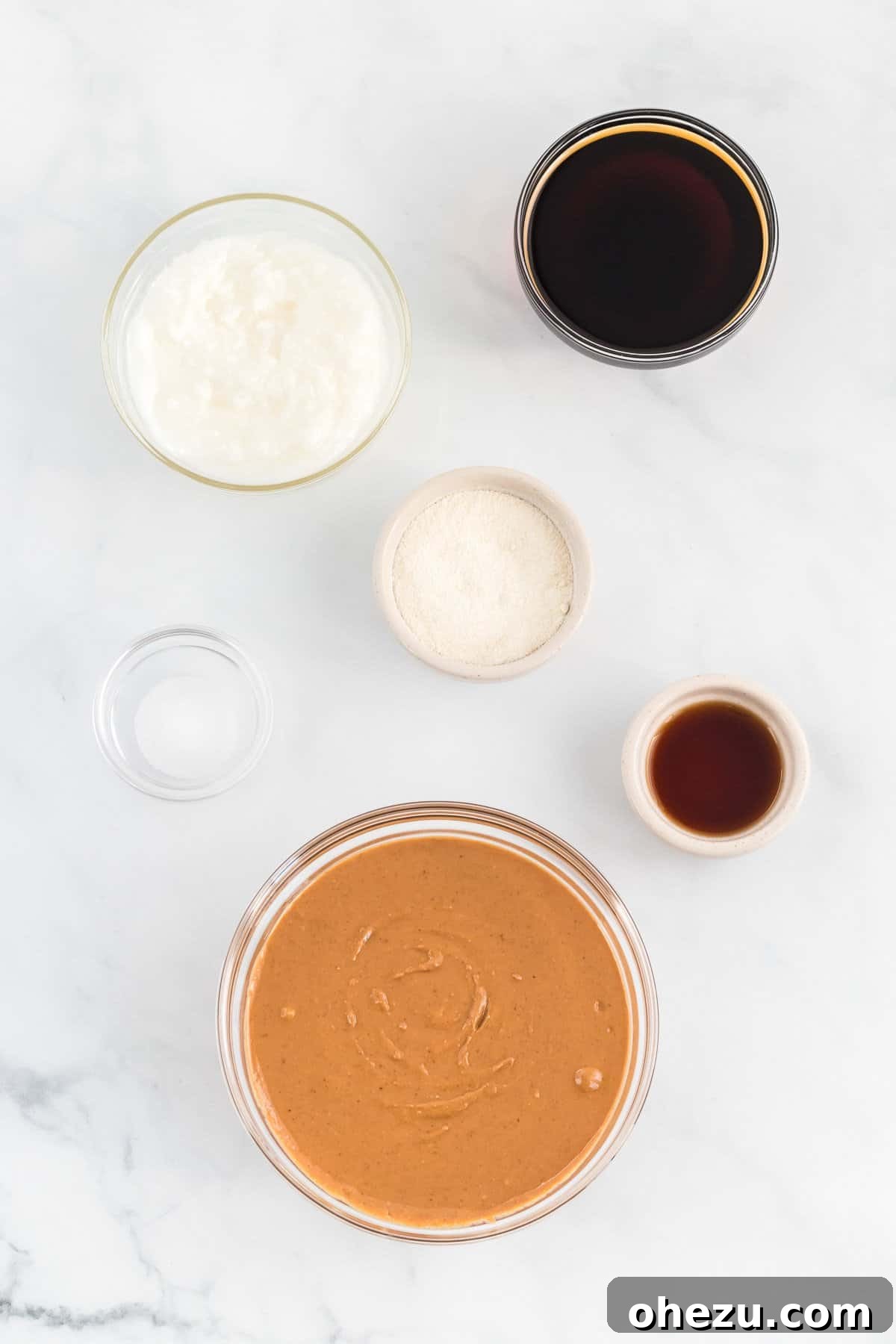 Ingredients needed to make vegan peanut butter fudge: peanut butter, coconut oil, maple syrup, vanilla extract, coconut flour, sea salt.