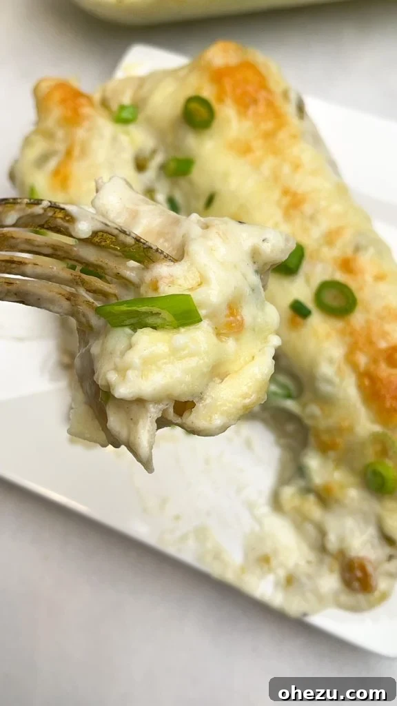 Bright and Creamy Chicken Enchiladas 4 A baking dish full of Tangy White Chicken Enchiladas, ready to be served