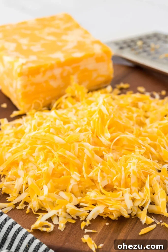 5-Minute Creamy Nacho Cheese Dip 10 Close-up shot of fluffy, finely shredded Colby Jack cheese, emphasizing its quality for melting.