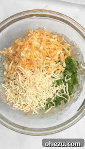 Frying corn fritters until golden brown.