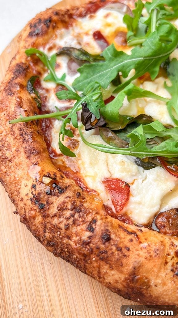 Naples' Authentic Pizza Masterpiece 2 Delicious authentic Neapolitan pizza with fresh ingredients, showing a perfectly charred crust