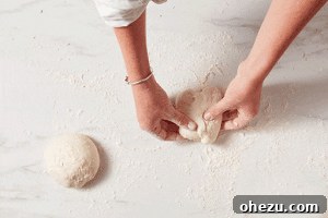 Naples' Authentic Pizza Masterpiece 11 Step-by-step image of folding pizza dough