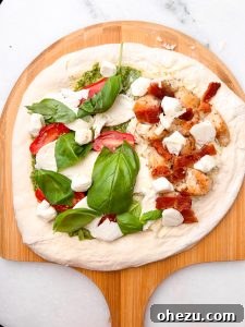Naples' Authentic Pizza Masterpiece 17 Adding fresh mozzarella cheese to pizza dough