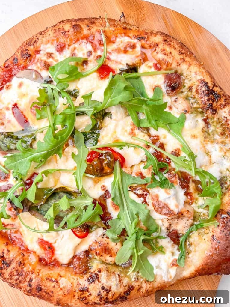 Naples' Authentic Pizza Masterpiece 4 Freshly baked Neapolitan pizza with mozzarella and basil, ready to be sliced