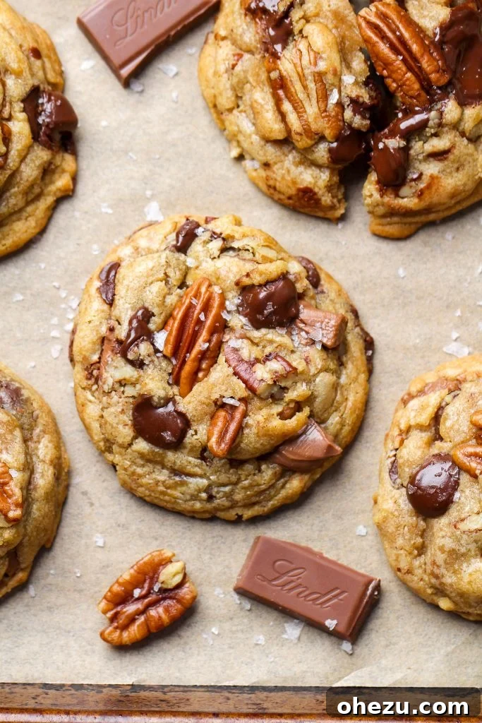 Liqueur Spiked Brown Butter Pecan Cookies 6 Stacked brown butter pecan cookies with Rivulet Pecan Liqueur bottle