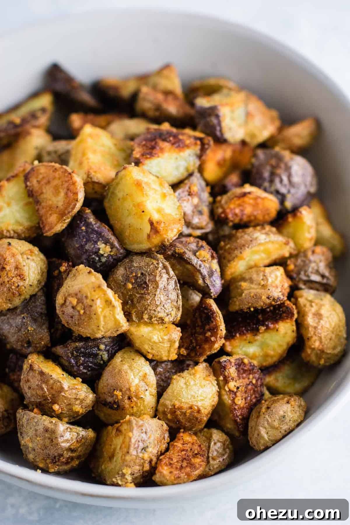 Perfectly roasted garlic parmesan potatoes with crispy edges, ready to serve as an easy side dish.