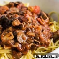 Easy meatless spaghetti sauce recipe made with mushrooms, garlic, and onions. A delicious 'meaty' vegetarian spaghetti recipe.