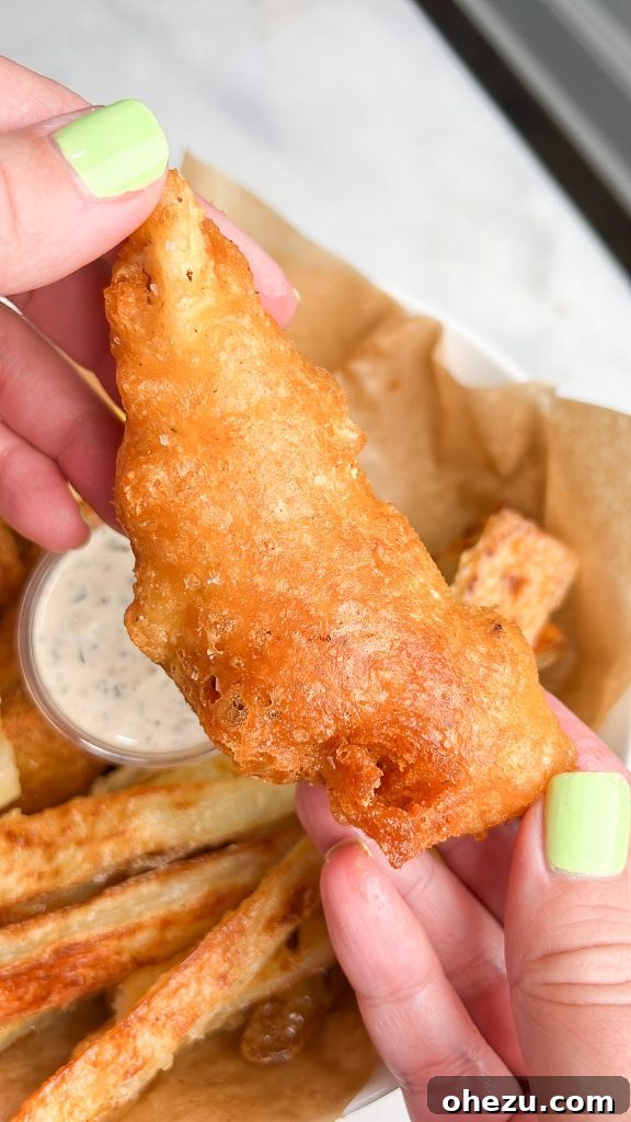 Close-up of crispy beer-battered halibut and golden fries