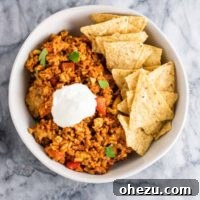 Tofu Mexican Rice Casserole Recipe with bell peppers and mushrooms. Scrambled tofu adds extra protein to this delicious vegetarian take on a healthier Mexican rice casserole. Serve with chips and sour cream!