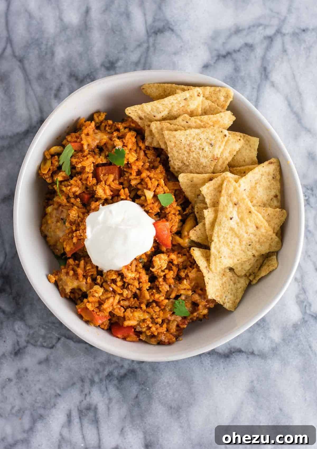 Hearty Tofu Mexican Rice Bake 8 The full Tofu Mexican Rice Casserole in a large casserole dish, freshly baked and bubbly, ready to be served. A perfect family-sized vegetarian meal that's both wholesome and flavorful.