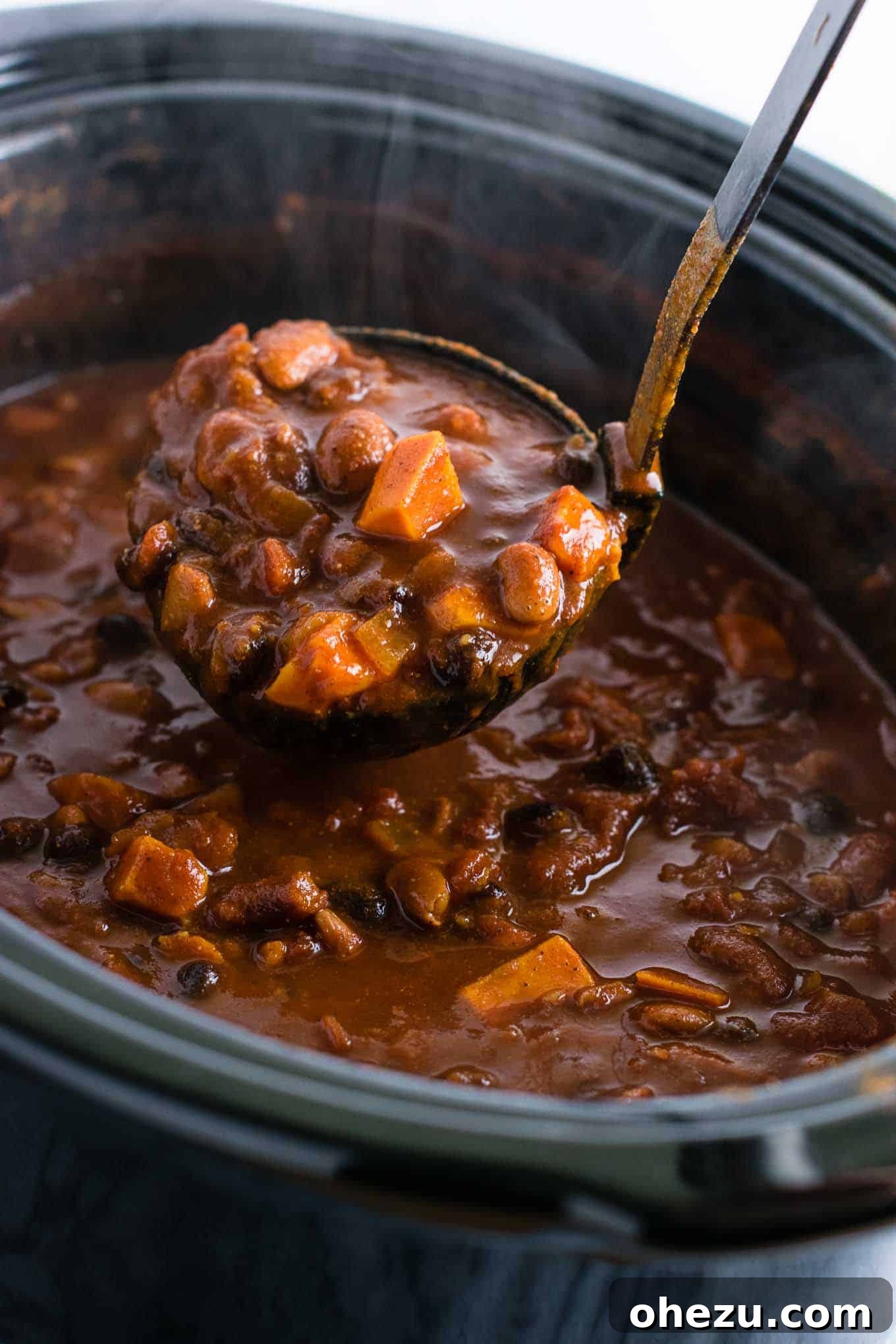 Effortless Plant-Based Sweet Potato Chili in Your Slow Cooker 10 Multiple portions of slow cooker vegetarian sweet potato chili stored in freezer-safe containers, ready for future meals, illustrating effective meal prepping.