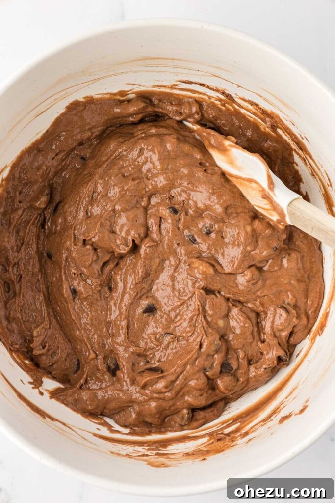 chocolate muffin batter in a mixing bowl