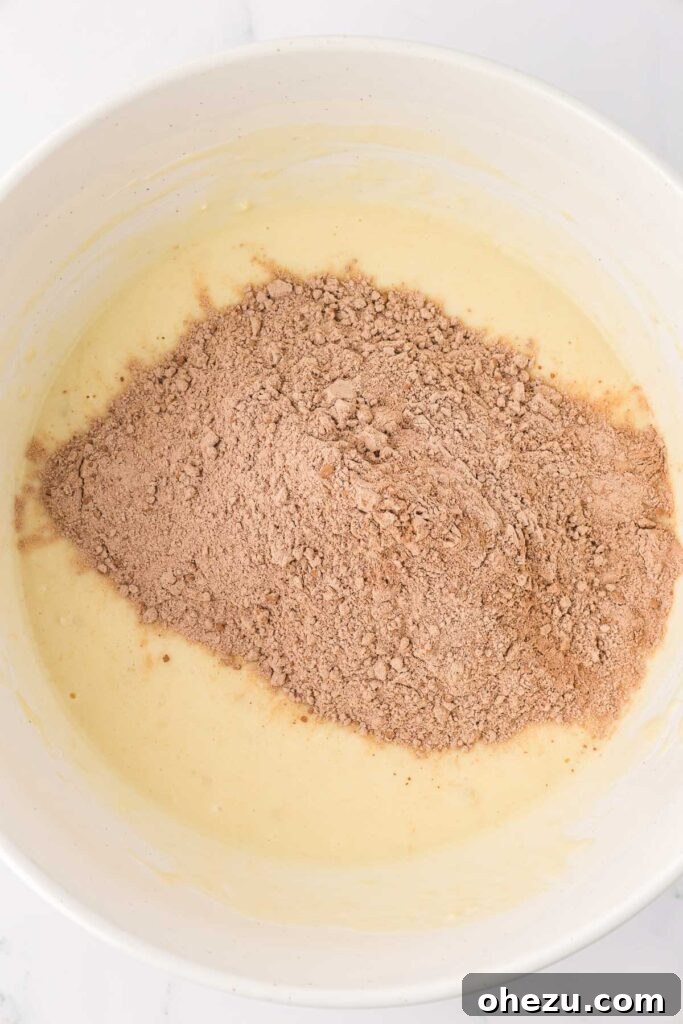 adding the dry ingredients to the wet ingredients