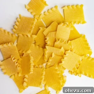 Assortment of various pasta shapes, including flat Taccole, penne, and rigatoni, suitable for baked pasta dishes