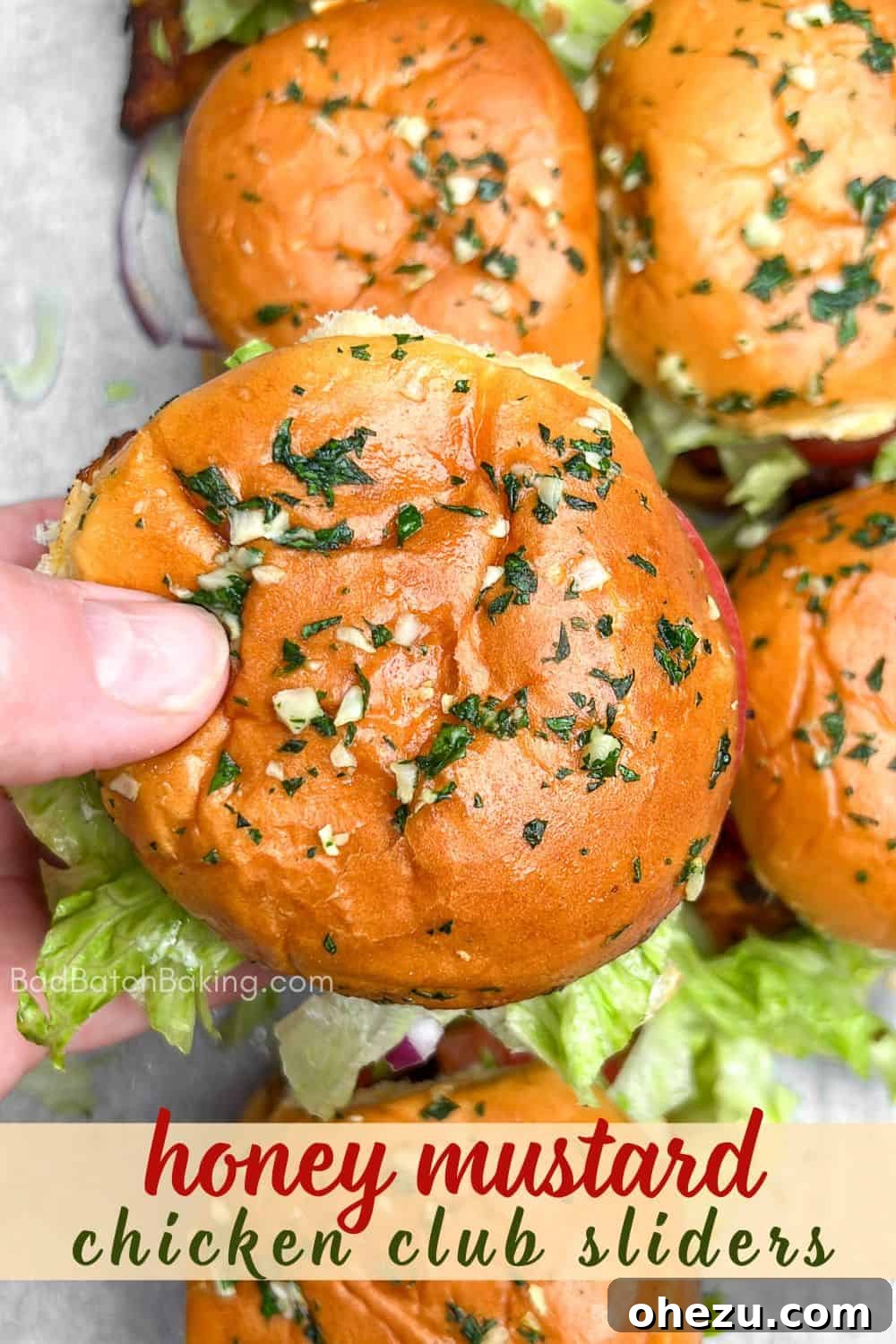 Sweet & Tangy Honey Mustard Chicken BLT Sliders 10 Close-up of a stack of Honey Mustard BLT Chicken Sliders, showcasing layers of ingredients