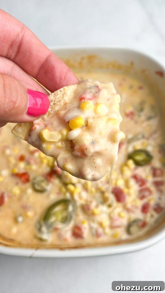 Silky smooth restaurant-style queso blanco with sweet corn served with tortilla chips