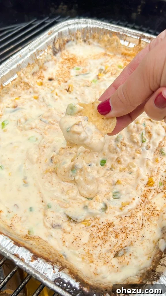Beer Smoked Queso, a cheesy dip with corn and beer
