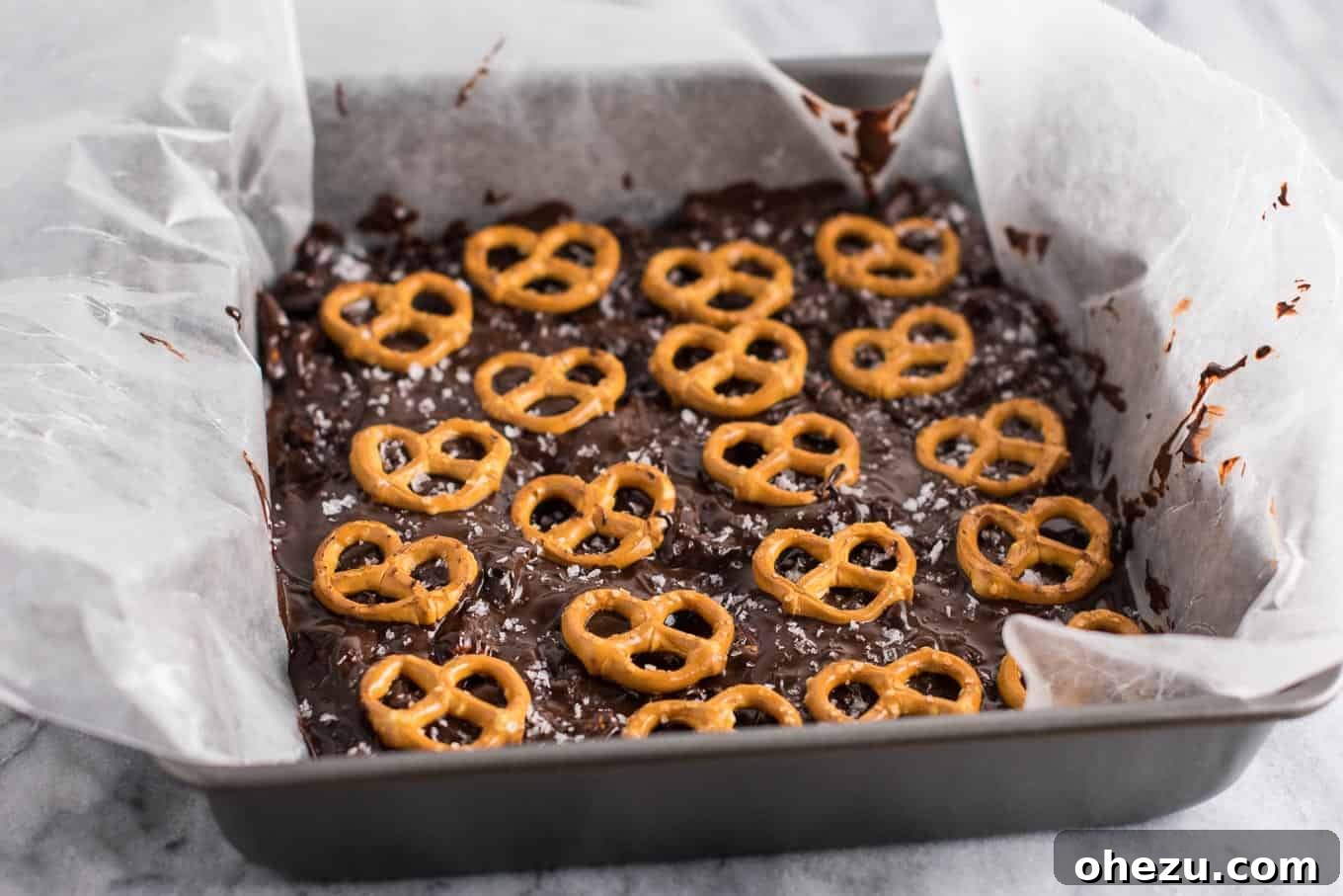 Vegan Sweet & Salty Chocolate Pretzel Bark 5 A generous serving of Vegan Chocolate Sea Salt Pretzel Bark, emphasizing the thick chocolate layer and abundant pretzel pieces.