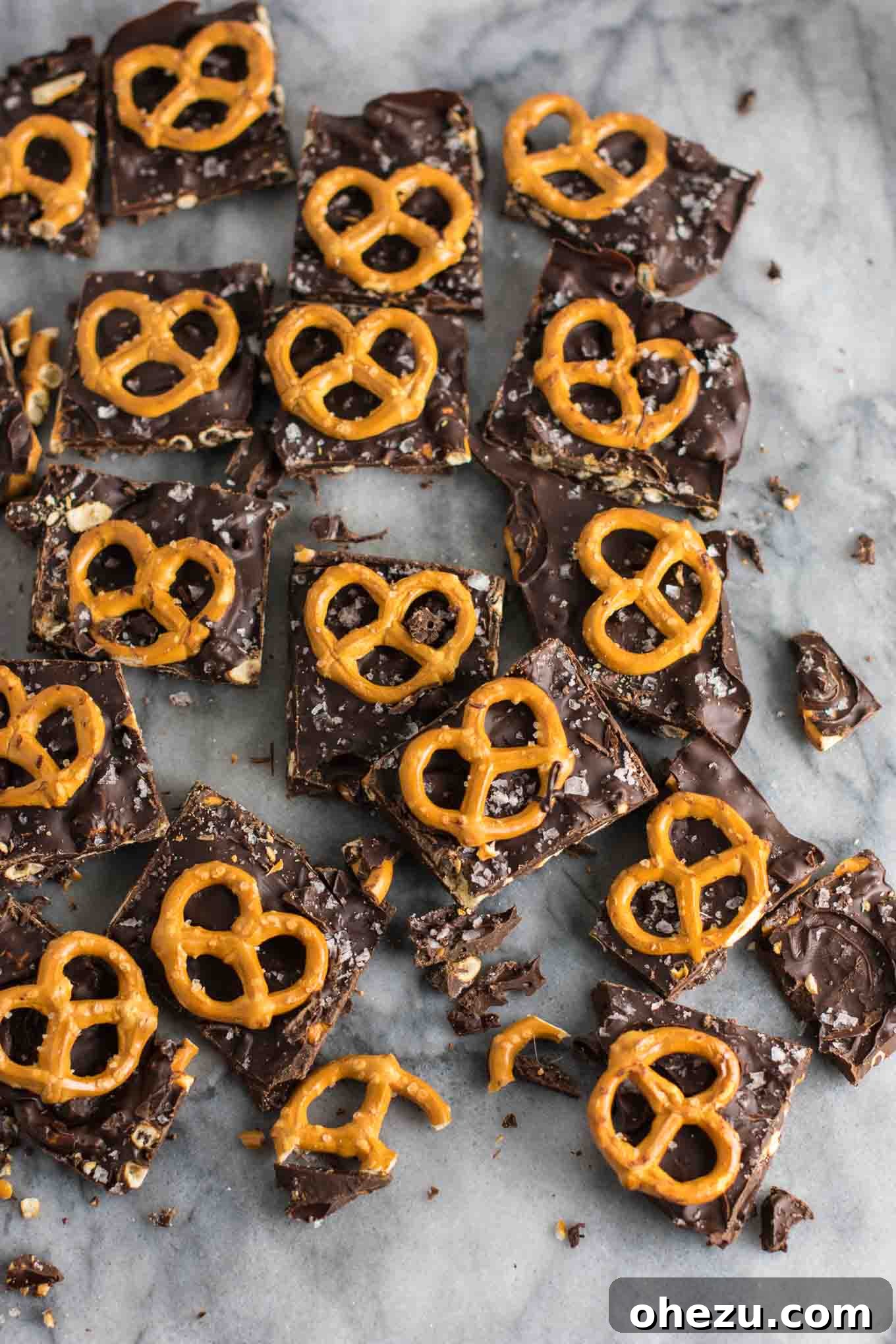 Vegan Sweet & Salty Chocolate Pretzel Bark 7 Pouring melted dairy-free dark chocolate and coconut oil into a pan, ready for the next step in making the vegan pretzel bark.