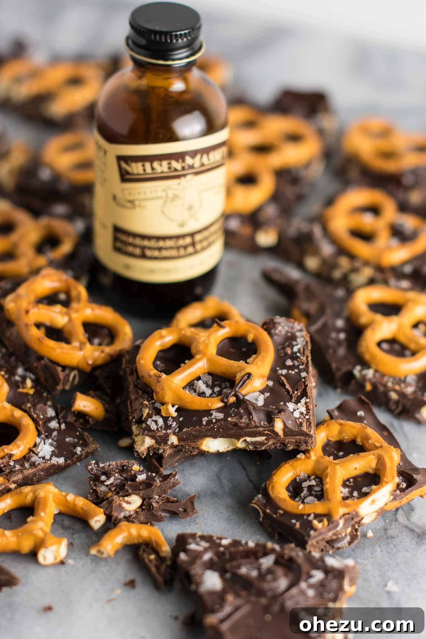 Vegan Sweet & Salty Chocolate Pretzel Bark 8 Adding chopped gluten-free pretzels into the melted chocolate mixture in a saucepan.