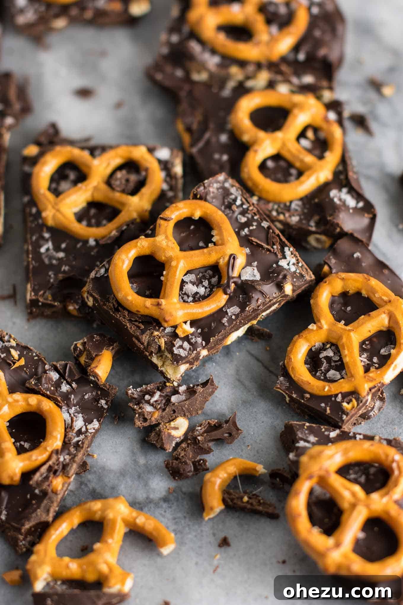 Vegan Sweet & Salty Chocolate Pretzel Bark 9 The chocolate and pretzel mixture being spread evenly into a wax paper-lined baking dish.