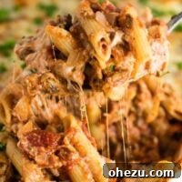 This Meatless Million Dollar Baked Ziti Recipe is an easy and impressive vegetarian dinner. Full of meaty mushrooms, fresh herbs, and four types of cheese! #meatless #milliondollarziti #bakedziti #vegetarian #dinner