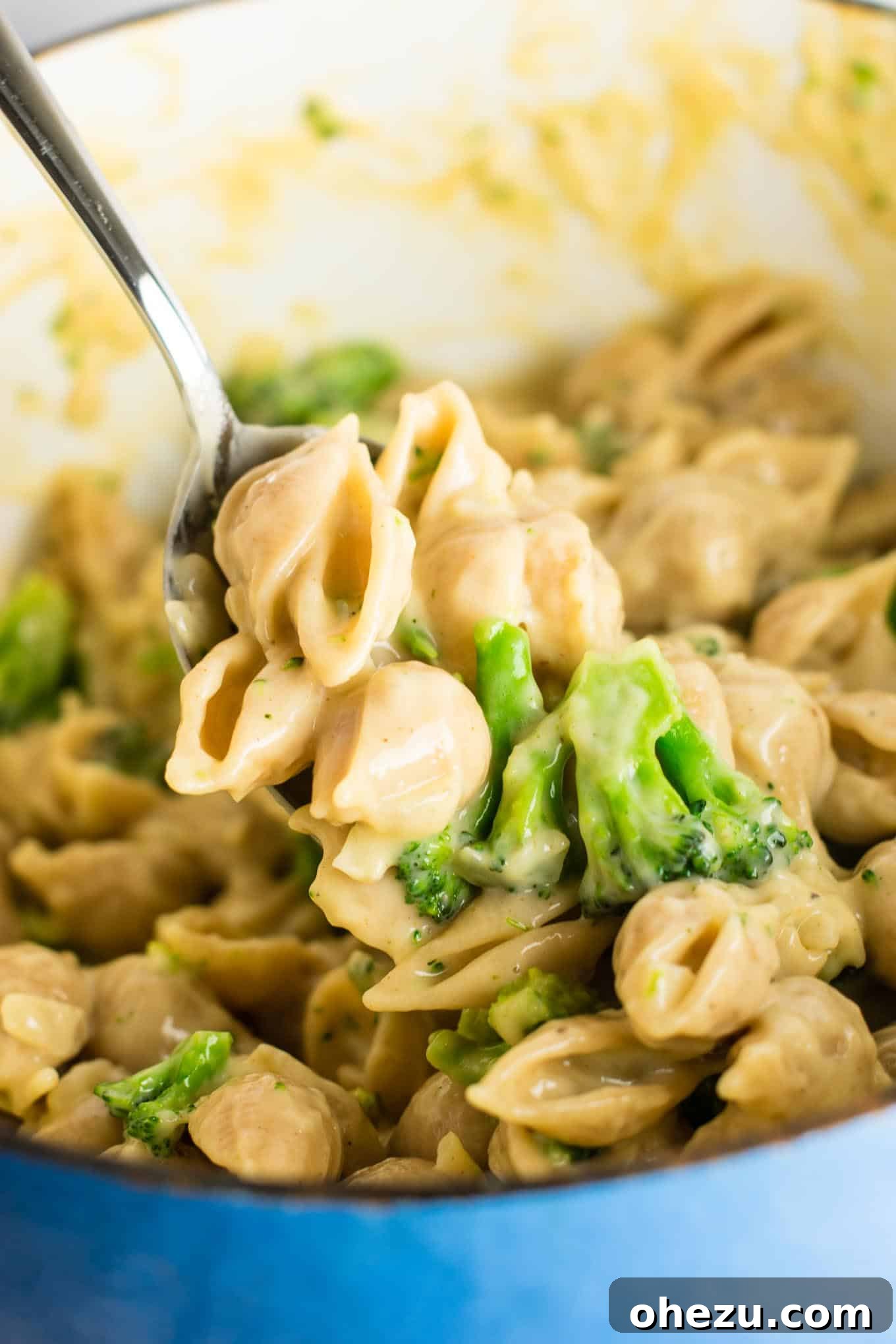 Lightened up broccoli shells and cheese with sharp cheddar cheese and whole wheat pasta. The healthiest way to justify eating macaroni and cheese for dinner. Kids will love this one! #broccolishellsandcheese #macandcheese #healthy #dinner #vegetarian #meatless #pasta #wholewheat