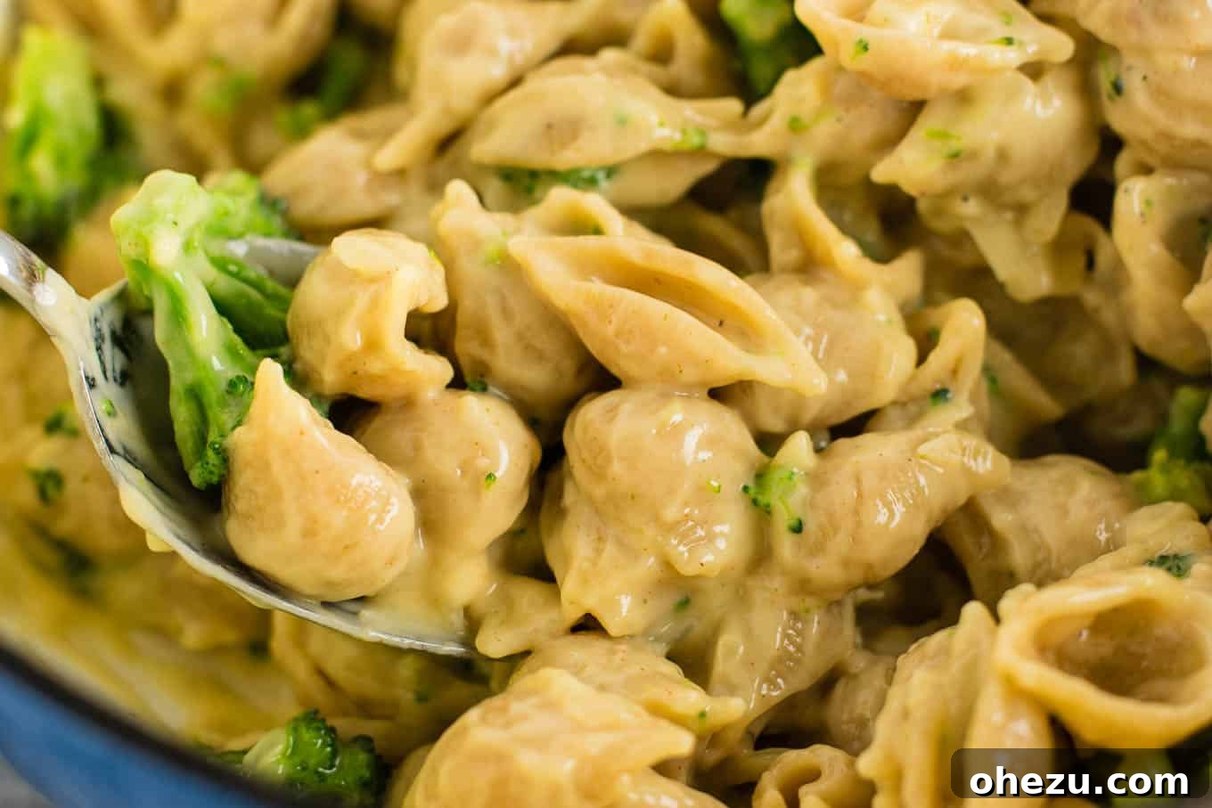 Lightened up broccoli shells and cheese with sharp cheddar cheese and whole wheat pasta. The healthiest way to justify eating macaroni and cheese for dinner. Kids will love this one! #broccolishellsandcheese #macandcheese #healthy #dinner #vegetarian #meatless #pasta #wholewheat