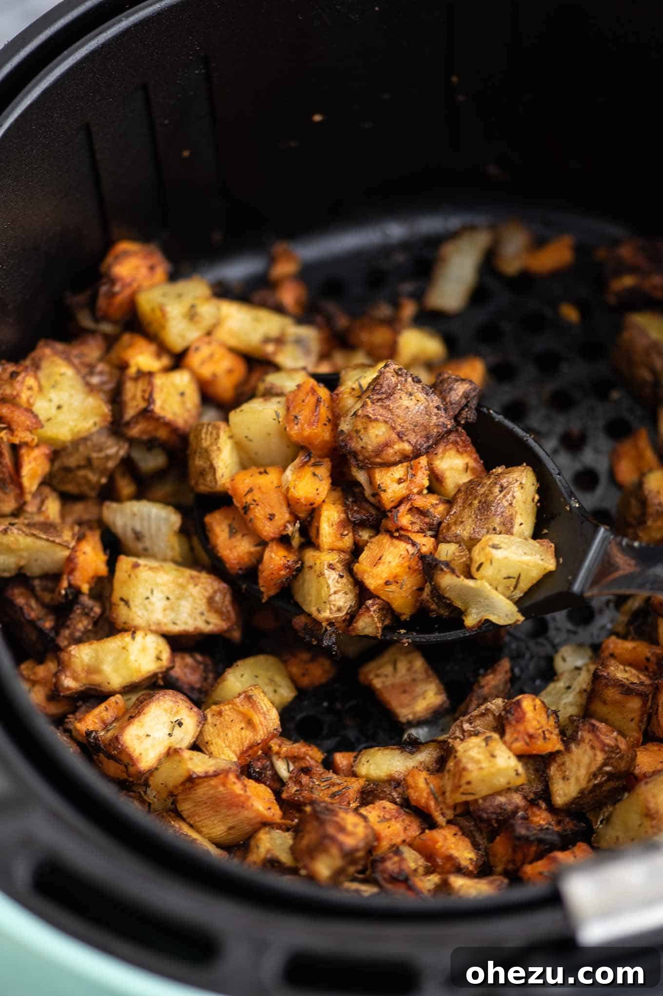 Breakfast Burrito Bliss 7 A vibrant air fryer breakfast hash recipe, featuring finely diced, golden-brown potatoes seasoned to perfection.