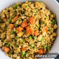 This cauliflower tofu fried rice is vegan, gluten free, grain free, and low carb. You won't believe this doesn't have rice or eggs in it! My new favorite dinner recipe! #grainfree #glutenfree #cauliflowerfriedrice #tofufriedrice #vegan #dinner #eggfree