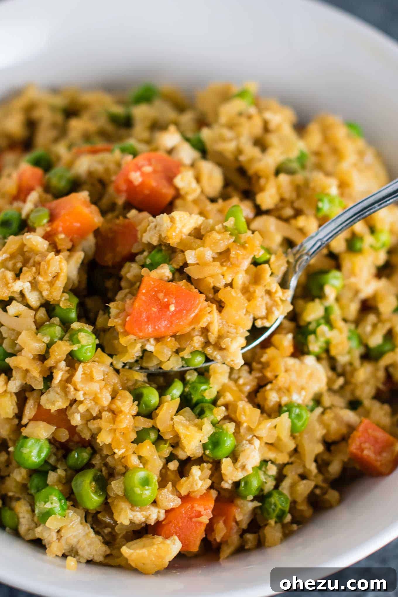 Flavorful Tofu and Cauliflower Rice Stir-Fry 5 This cauliflower tofu fried rice is vegan, gluten free, grain free, and low carb. You won't believe this doesn't have rice or eggs in it! My new favorite dinner recipe! #grainfree #glutenfree #cauliflowerfriedrice #tofufriedrice #vegan #dinner #eggfree