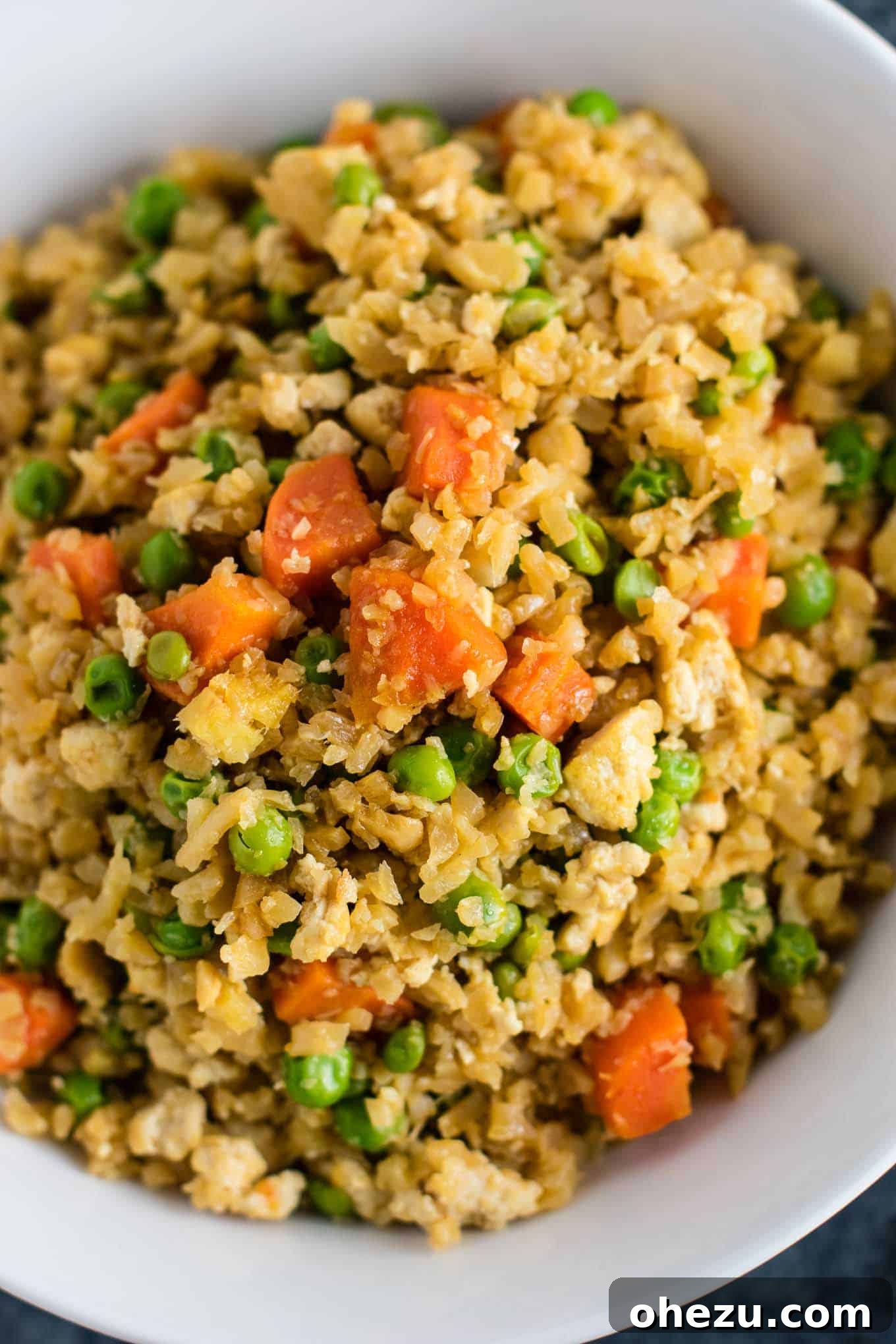 Flavorful Tofu and Cauliflower Rice Stir-Fry 7 This cauliflower tofu fried rice is vegan, gluten free, grain free, and low carb. You won't believe this doesn't have rice or eggs in it! My new favorite dinner recipe! #grainfree #glutenfree #cauliflowerfriedrice #tofufriedrice #vegan #dinner #eggfree